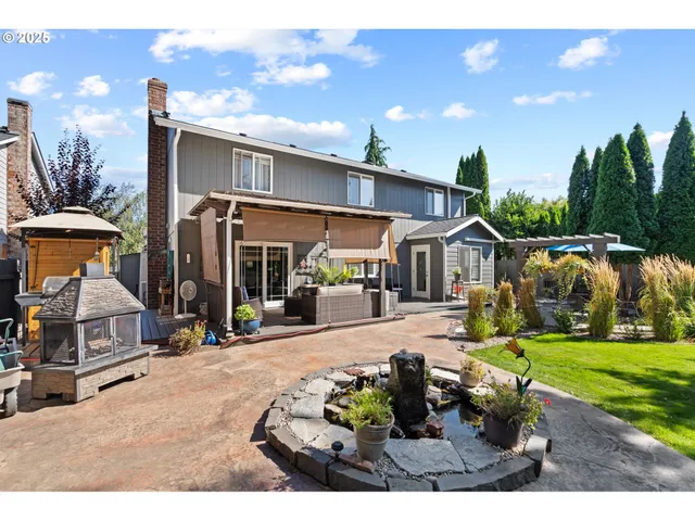 a view of house and yard with swimming pool