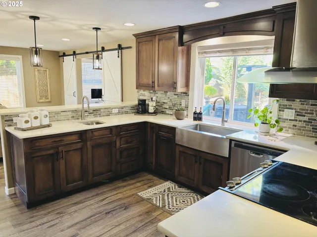 a kitchen with a sink stove and cabinets