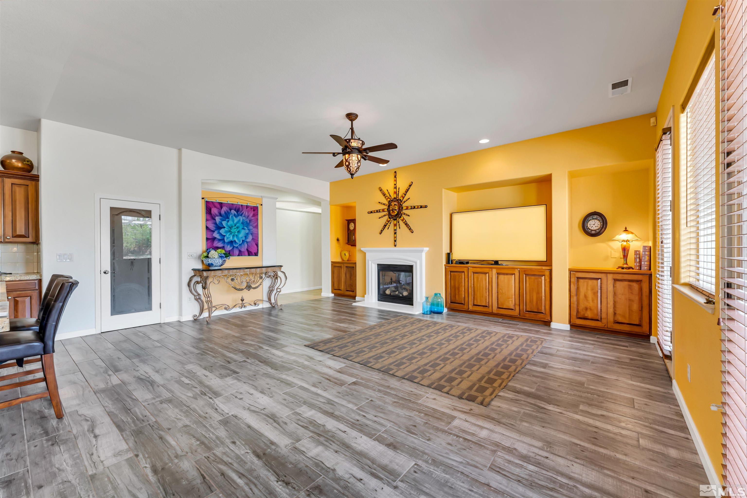 10555 Dillingham Drive Reno, NV 89521 - Photo 16 of 34 a view of a livingroom with furniture a ceiling fan and window