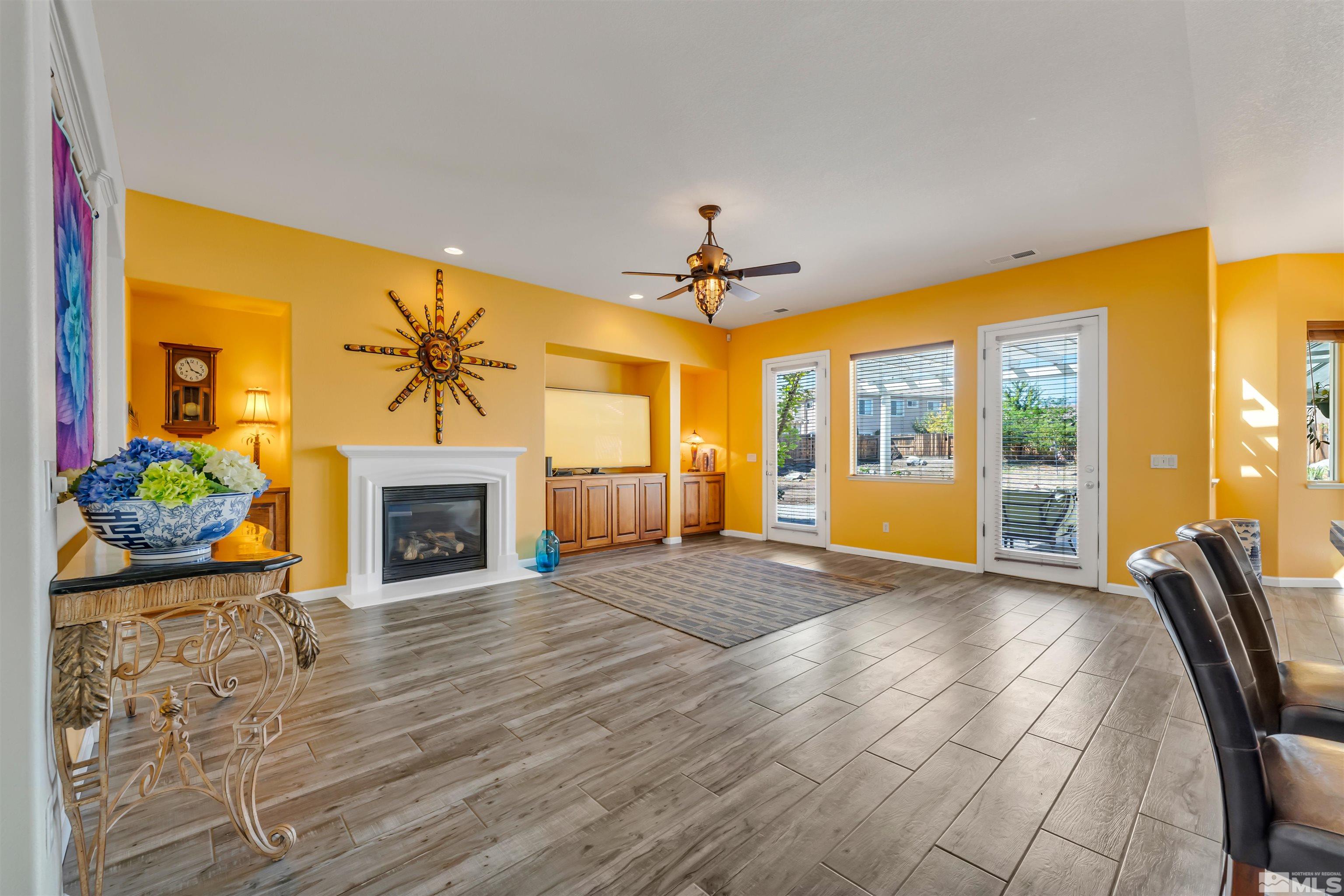 10555 Dillingham Drive Reno, NV 89521 - Photo 18 of 34 a view of livingroom with hardwood floor and a fireplace