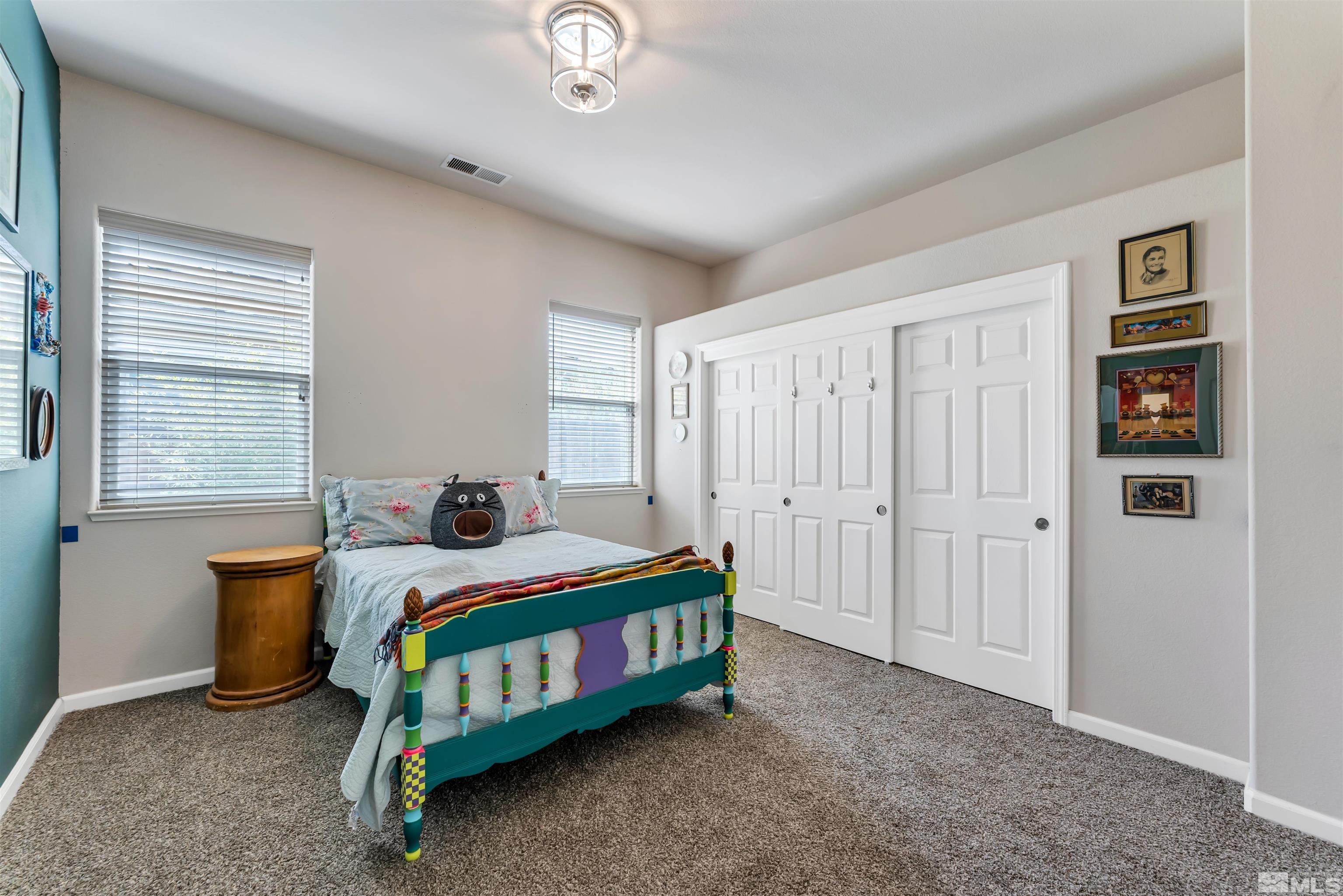 10555 Dillingham Drive Reno, NV 89521 - Photo 27 of 34 a bedroom with a bed and a window