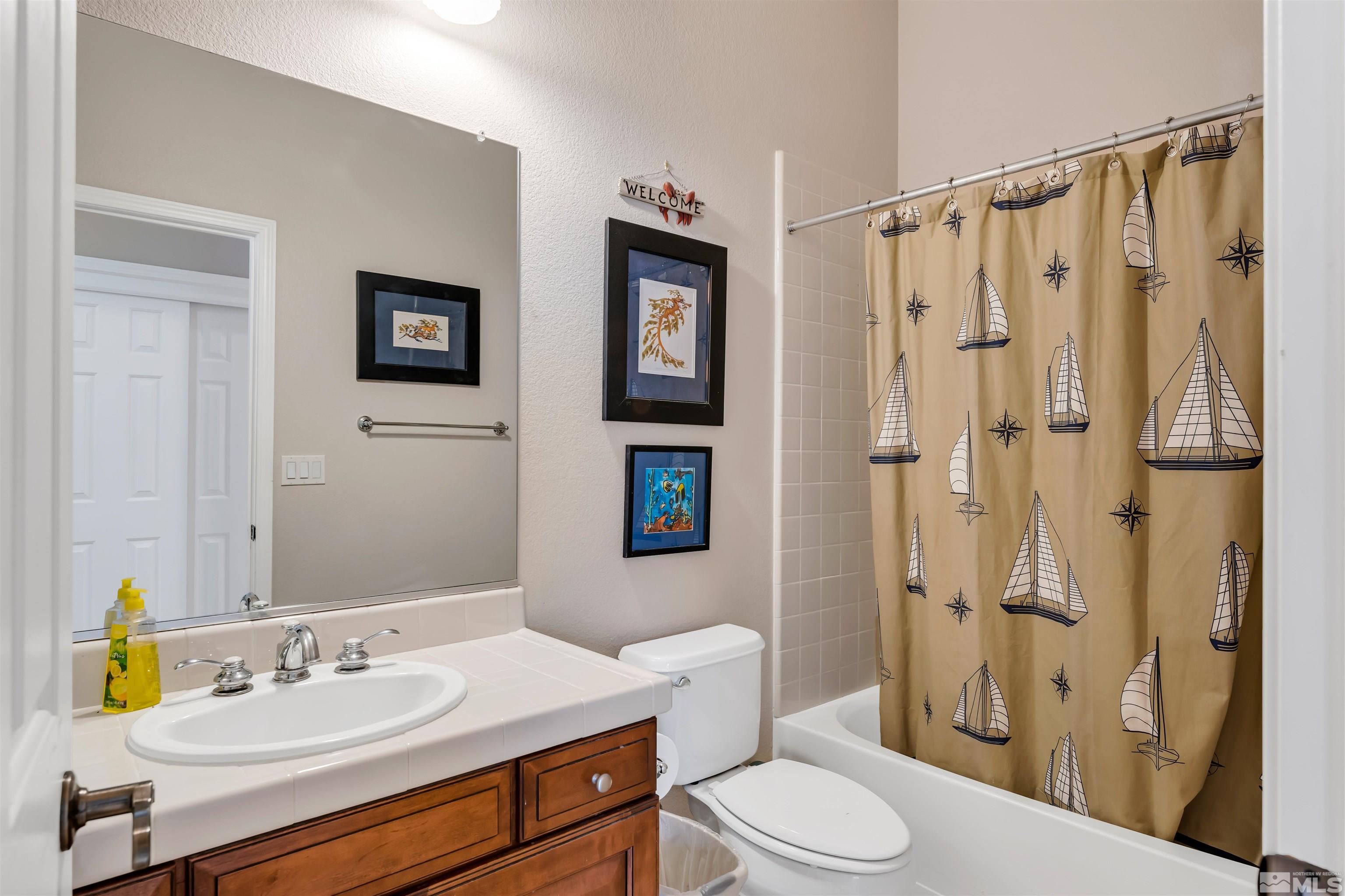 10555 Dillingham Drive Reno, NV 89521 - Photo 29 of 34 a bathroom with a sink toilet and shower