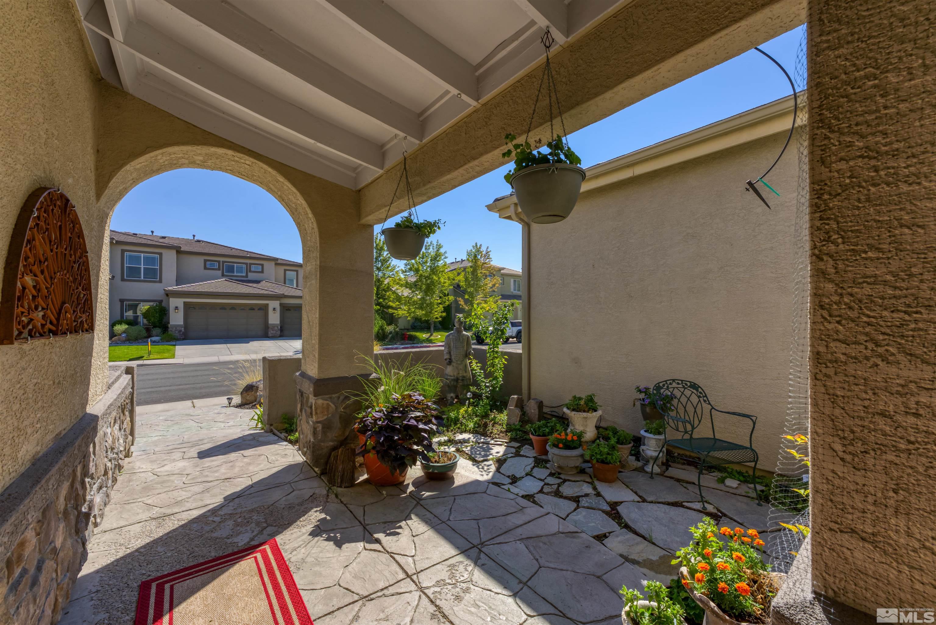 10555 Dillingham Drive Reno, NV 89521 - Photo 5 of 34 a front view of house with yard outdoor seating and barbeque oven