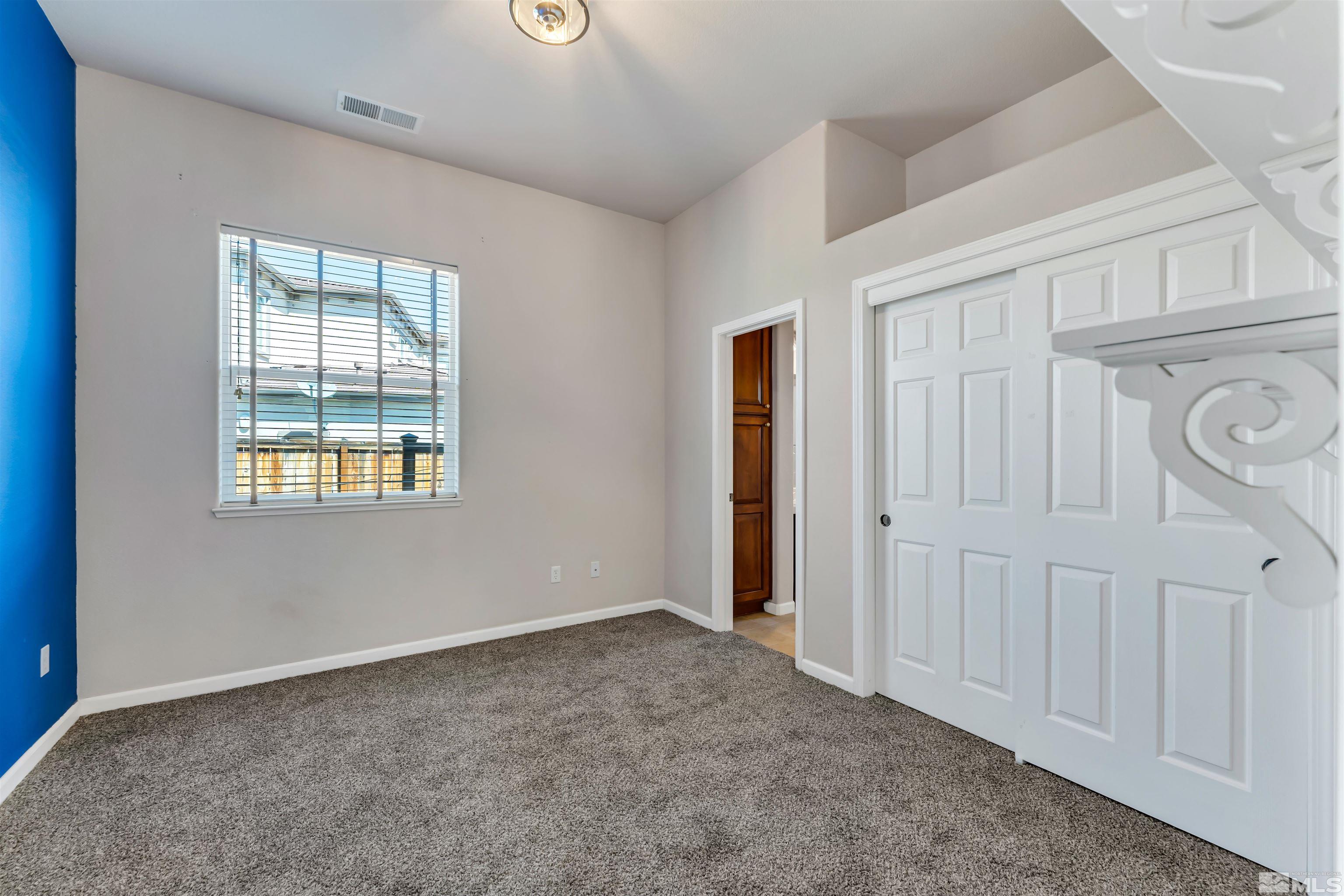 10555 Dillingham Drive Reno, NV 89521 - Photo 7 of 34 an empty room with windows