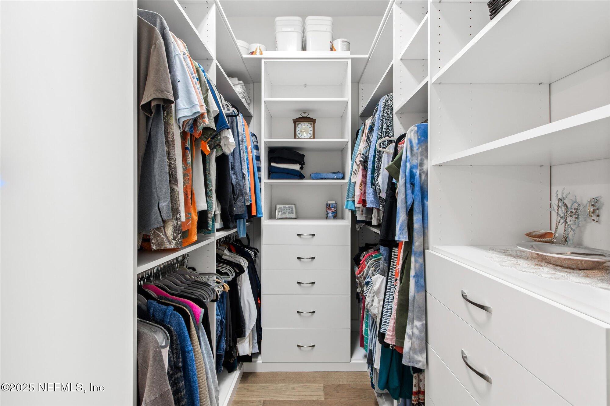 28341 Grandview Manor Yulee, FL 32097 - Photo 25 of 64 a view of walk in closet with clothes and shoes