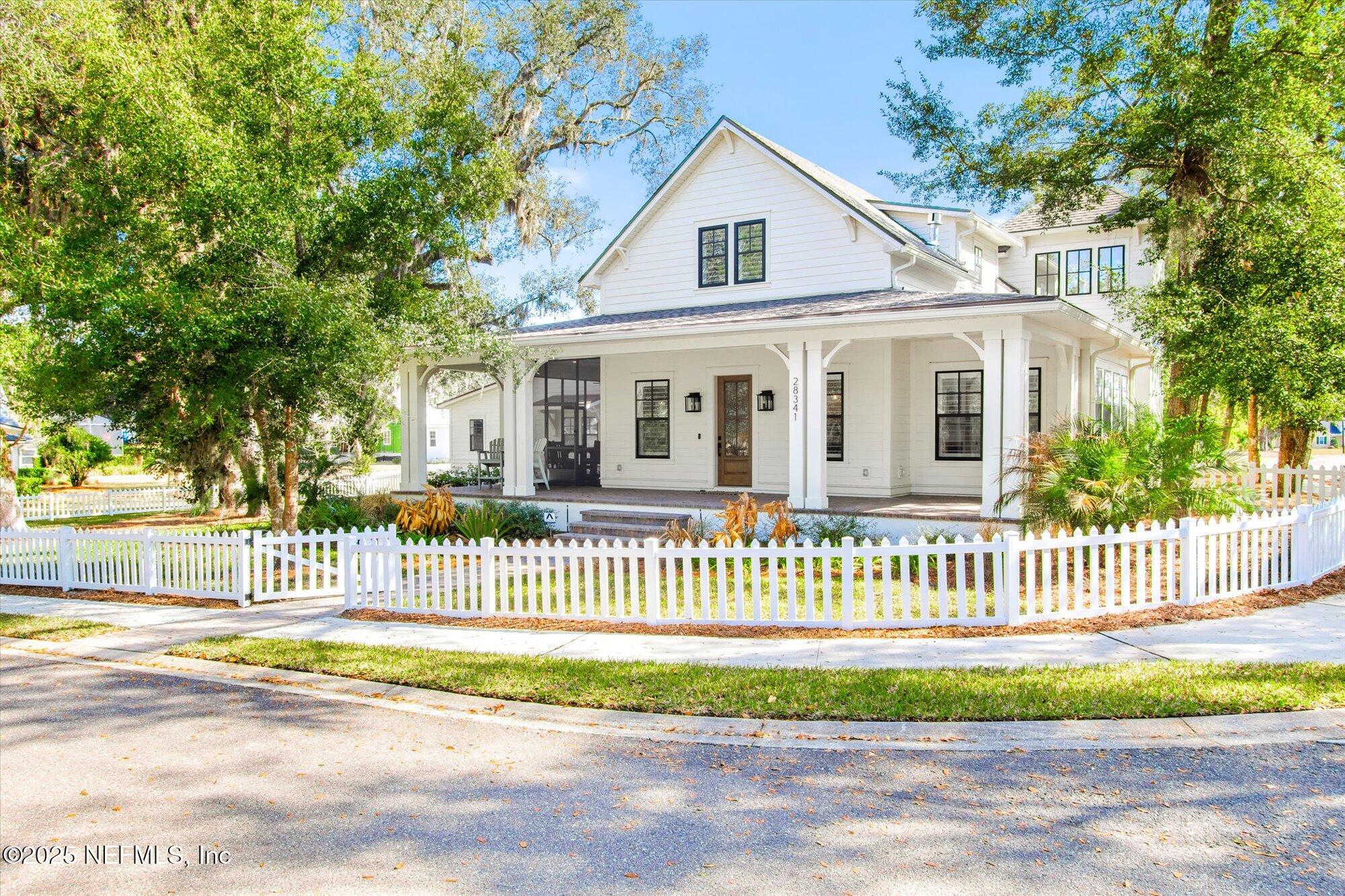28341 Grandview Manor Yulee, FL 32097 - Photo 44 of 64 a front view of a house with a garden and deck
