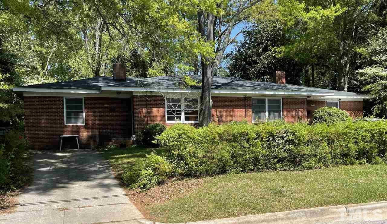 2716 Barmettler Street Raleigh, NC 27607 - Photo 1 of 1 a front view of a house with a garden