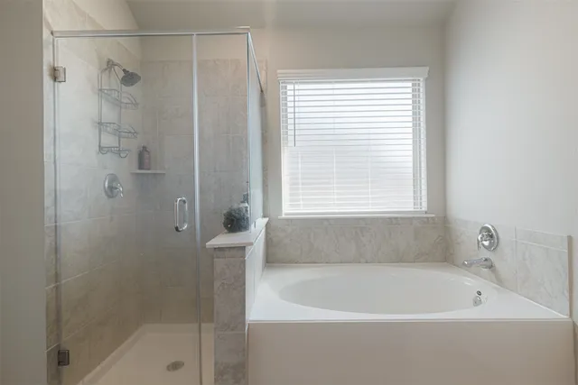 a white bath tub sitting next to a window