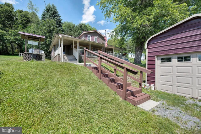 a view of a chair and table in the garden