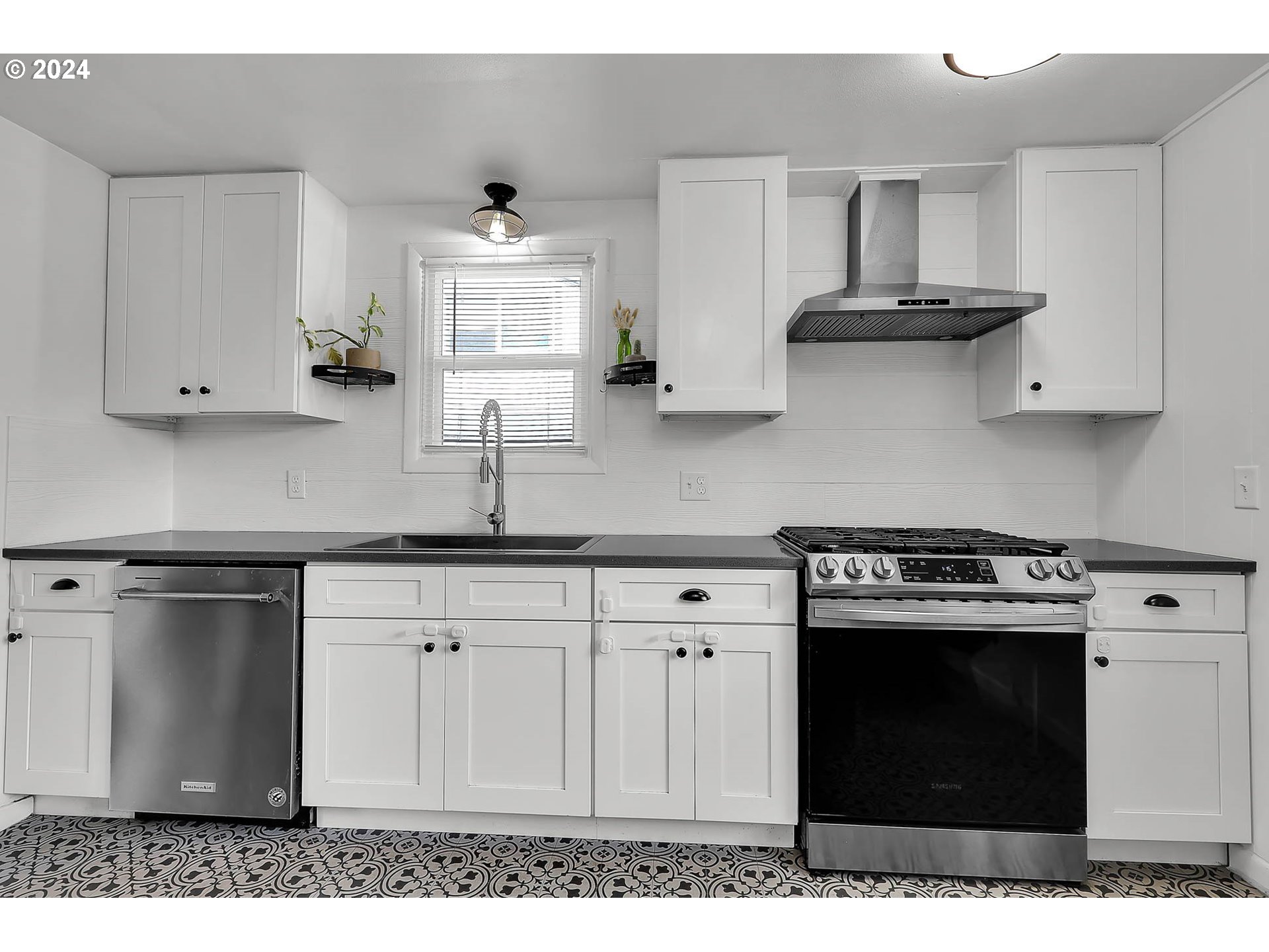 1617 Parnell Drive Eugene, OR 97404 - Photo 11 of 39 a kitchen with stainless steel appliances granite countertop a sink stove and cabinets