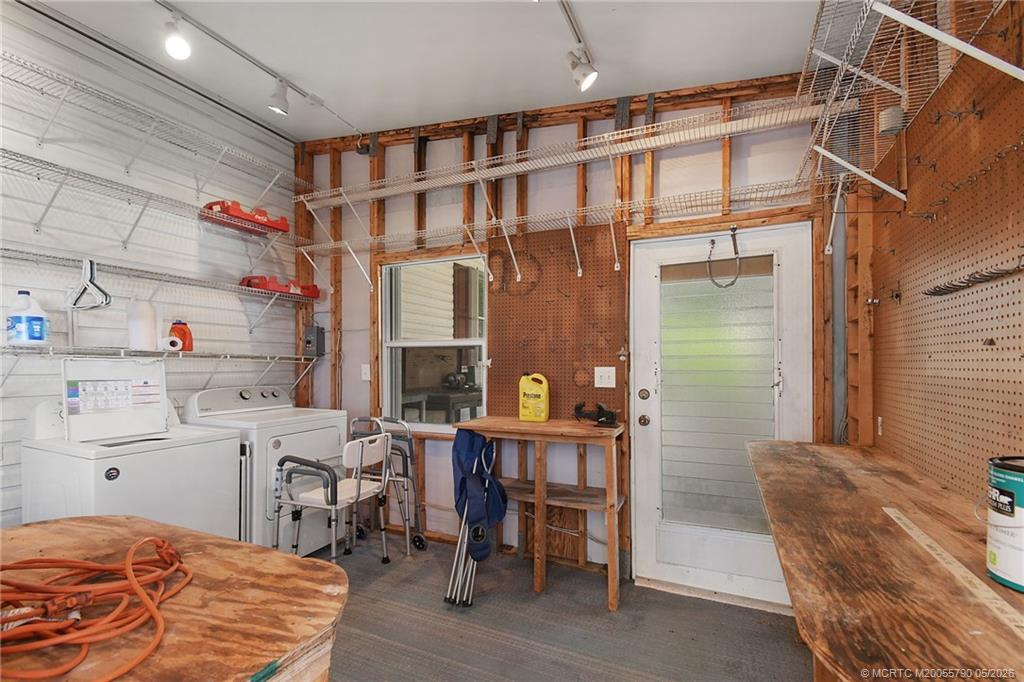 7149 Southeast Ridgeway Terrace Hobe Sound, FL 33455 - Photo 11 of 34 Storage area with work bench
