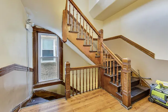 a view of wooden floor and windows in a room