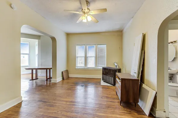 a view of wooden floor and windows in a room