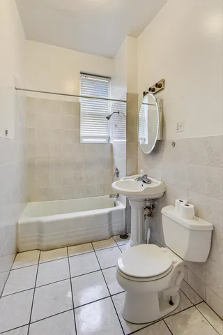 a front view of a building with parking