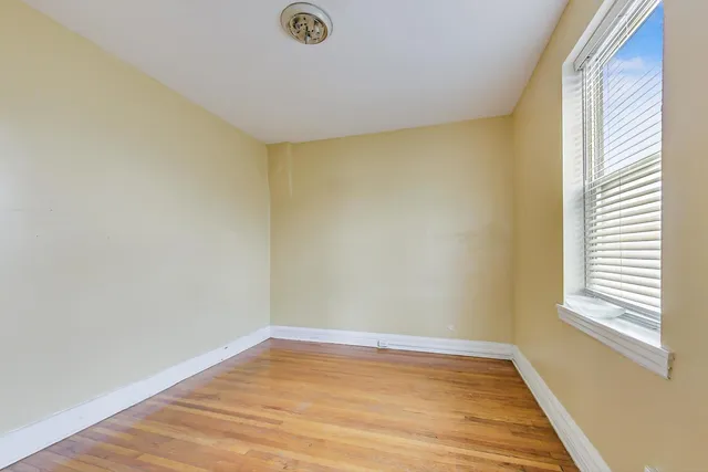 a view of living room with furniture and a fireplace