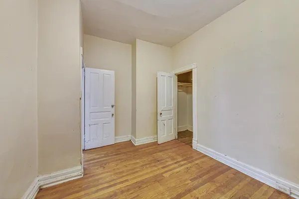 a bedroom with a bed and flat screen tv