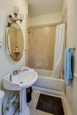a bathroom with a sink a toilet and a window