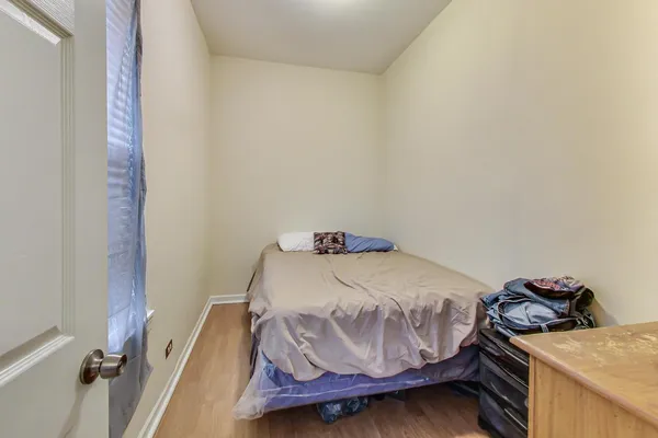 a bed room with a bed and a television