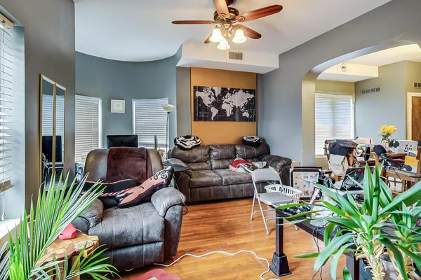 a living room with furniture and a large window