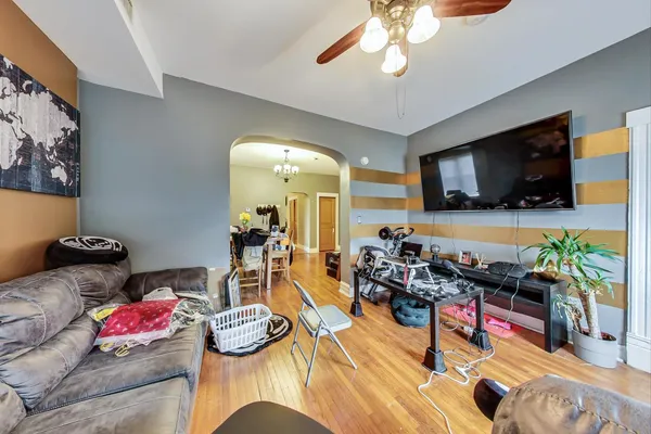 a view of living room with furniture and a fireplace