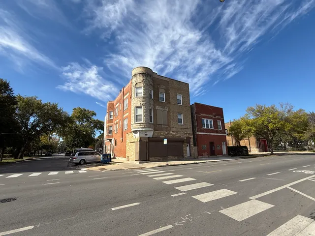 a view of a room with wooden floor and a window