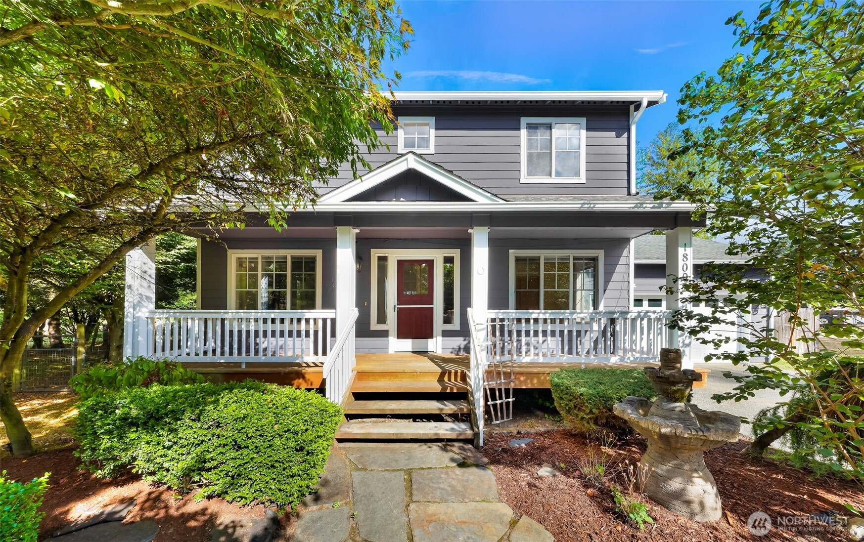 18002 Tualco Road Monroe, WA 98272 - Photo 1 of 39 a front view of a house with garden