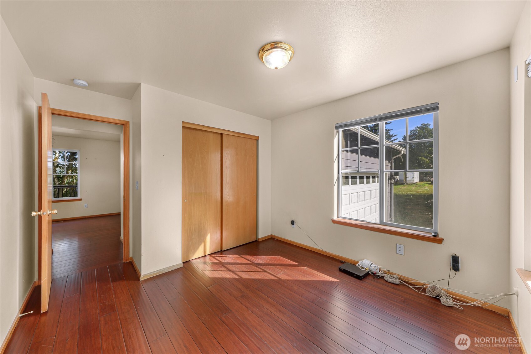 18002 Tualco Road Monroe, WA 98272 - Photo 15 of 39 an empty room with wooden floor and windows