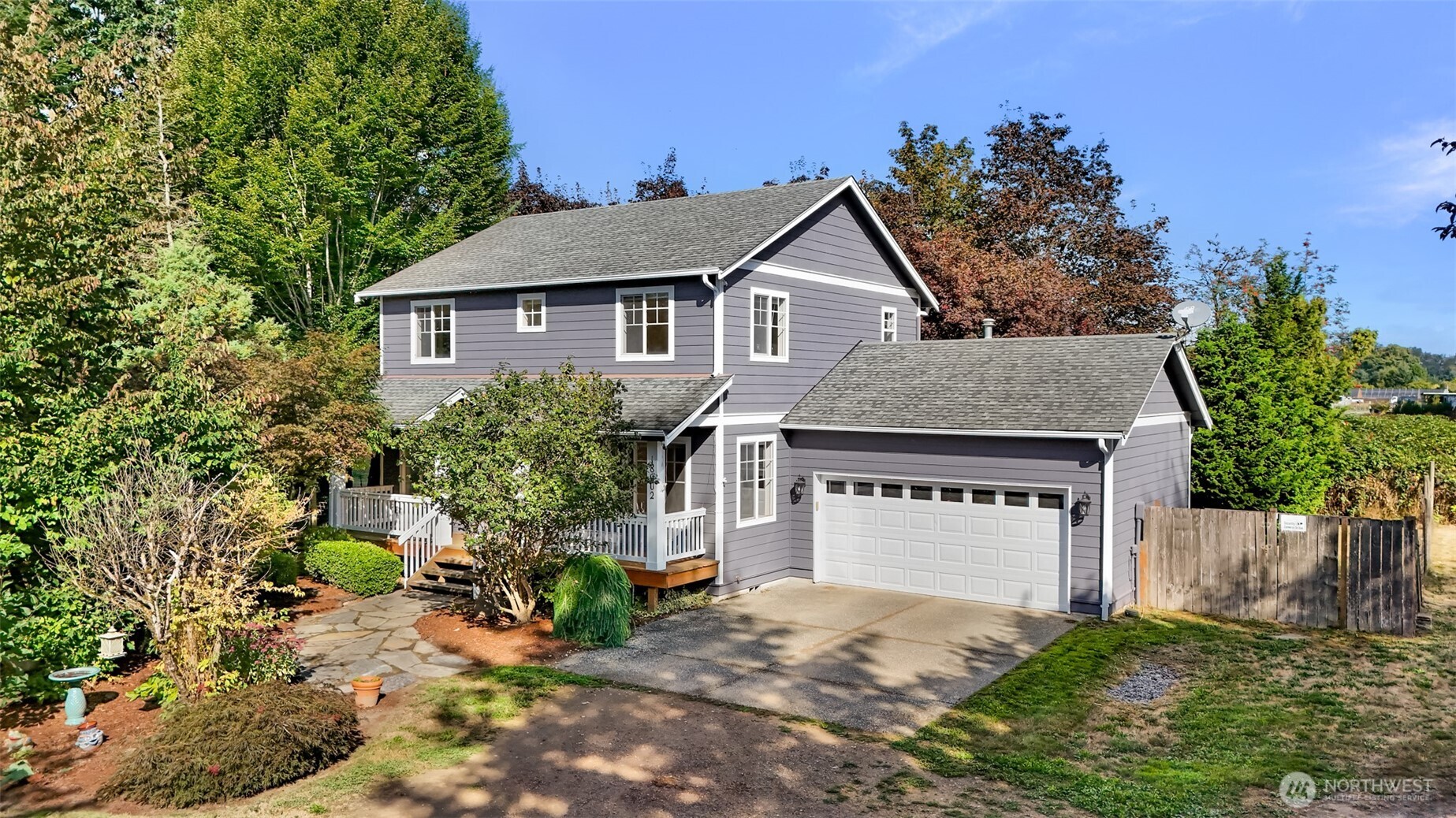 18002 Tualco Road Monroe, WA 98272 - Photo 2 of 39 a view of a house with a yard and potted plants