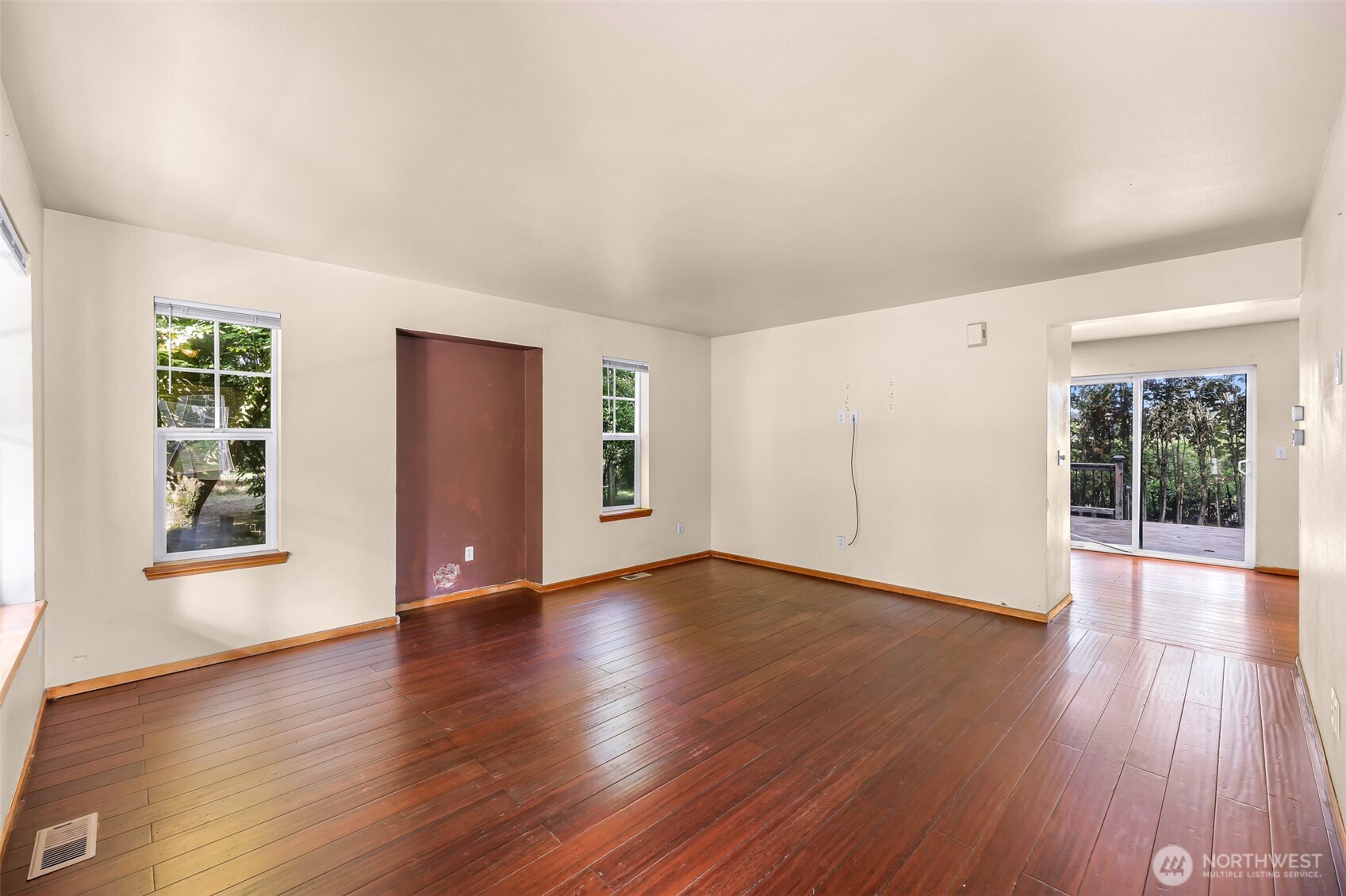 18002 Tualco Road Monroe, WA 98272 - Photo 6 of 39 an empty room with wooden floor and windows