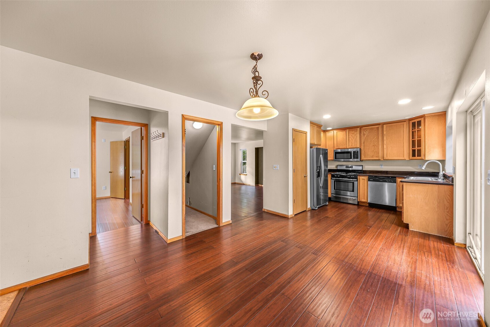 18002 Tualco Road Monroe, WA 98272 - Photo 9 of 39 a view of a big room with wooden floor and windows