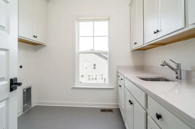 a view of cabinets and window