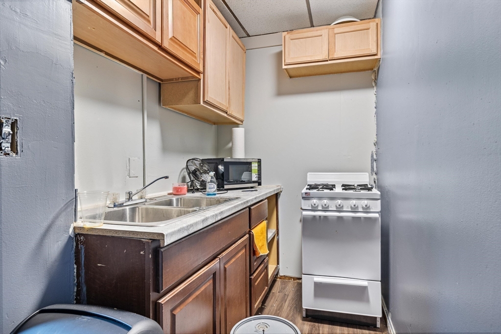 340 Harding Street Worcester, MA 01610 - Photo 13 of 42 a kitchen with a stove and a sink