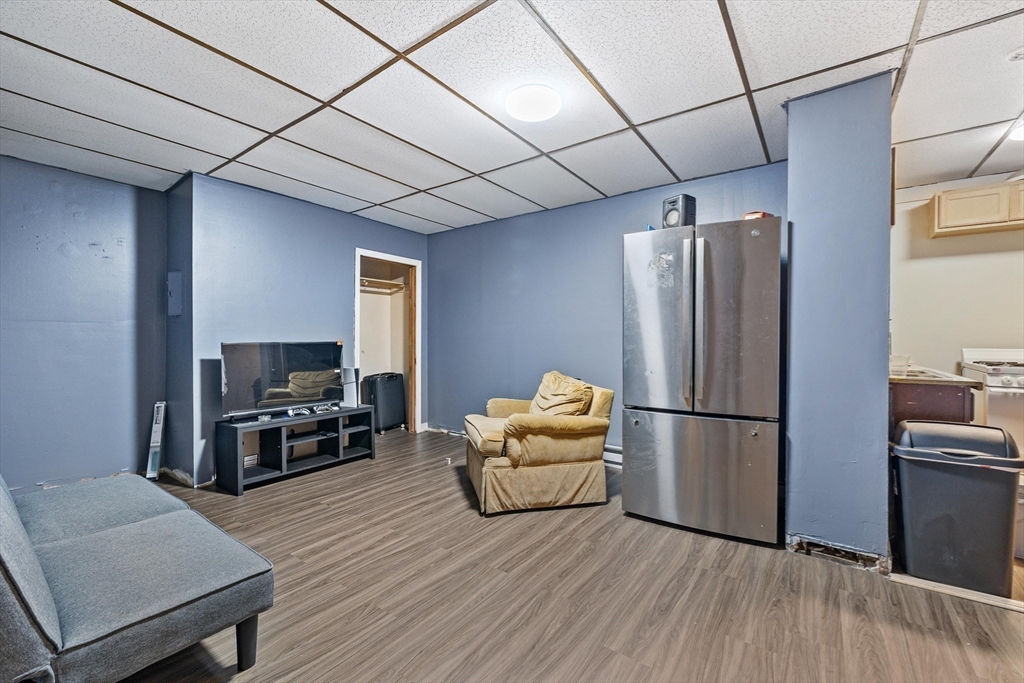 340 Harding Street Worcester, MA 01610 - Photo 16 of 42 a living room with furniture and a flat screen tv