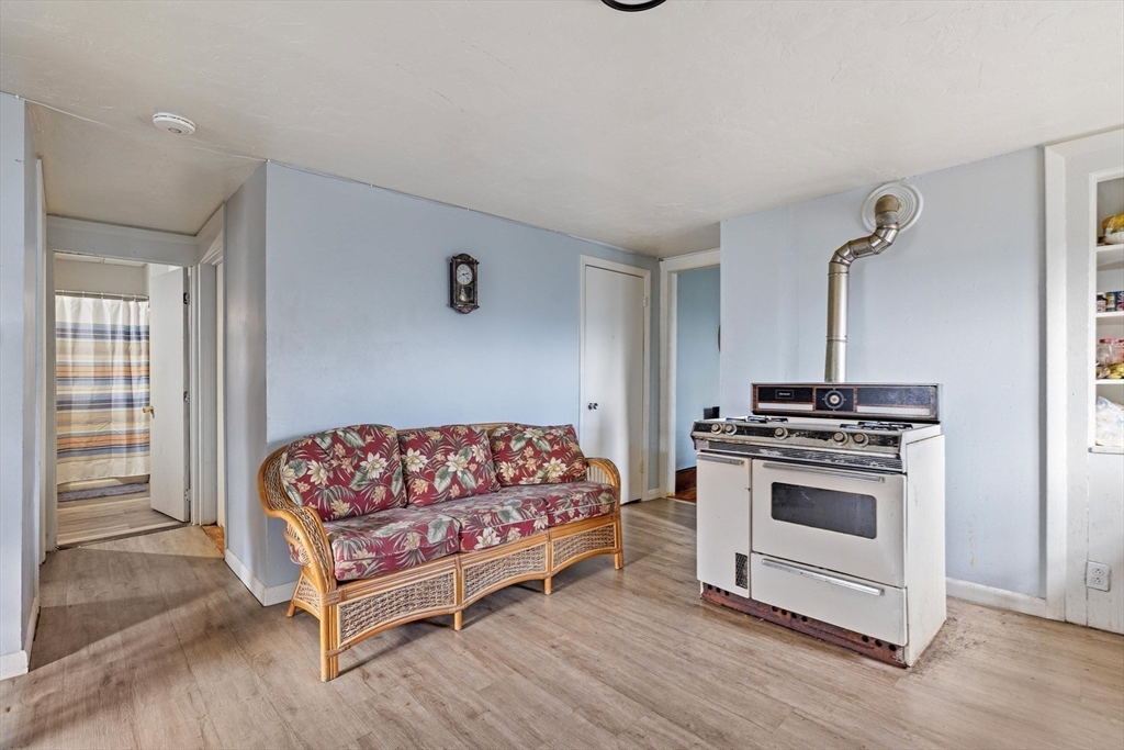340 Harding Street Worcester, MA 01610 - Photo 19 of 42 a bedroom with a bed and a dresser