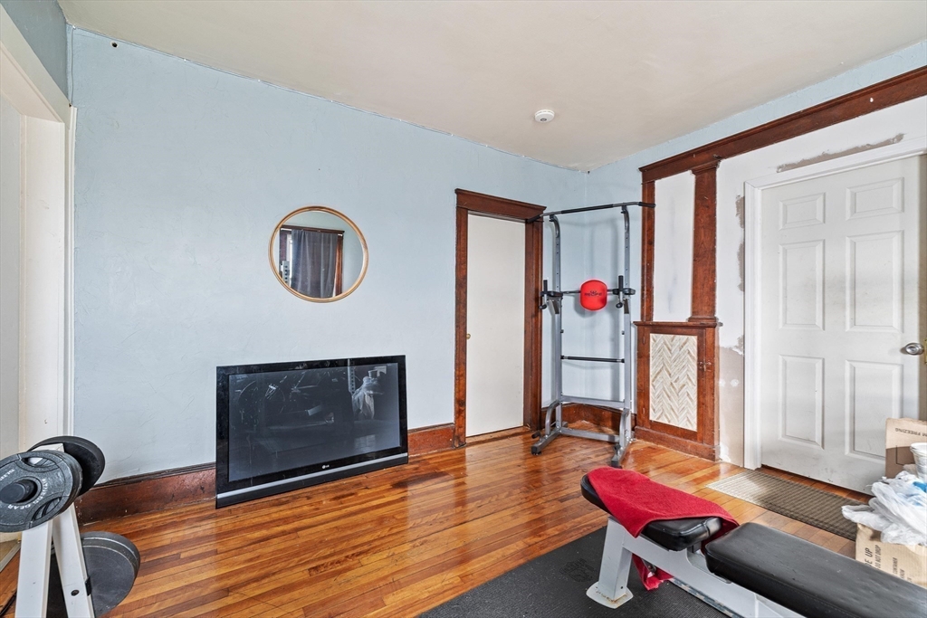 340 Harding Street Worcester, MA 01610 - Photo 22 of 42 a living room with furniture flat screen tv and a fireplace