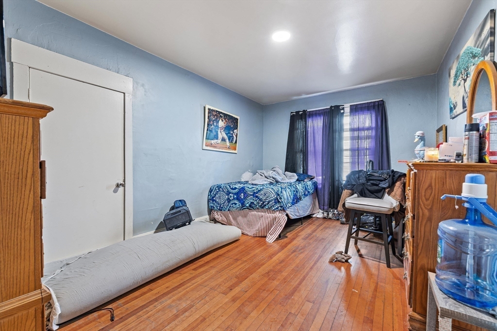 340 Harding Street Worcester, MA 01610 - Photo 25 of 42 a bedroom with furniture and a wooden floor
