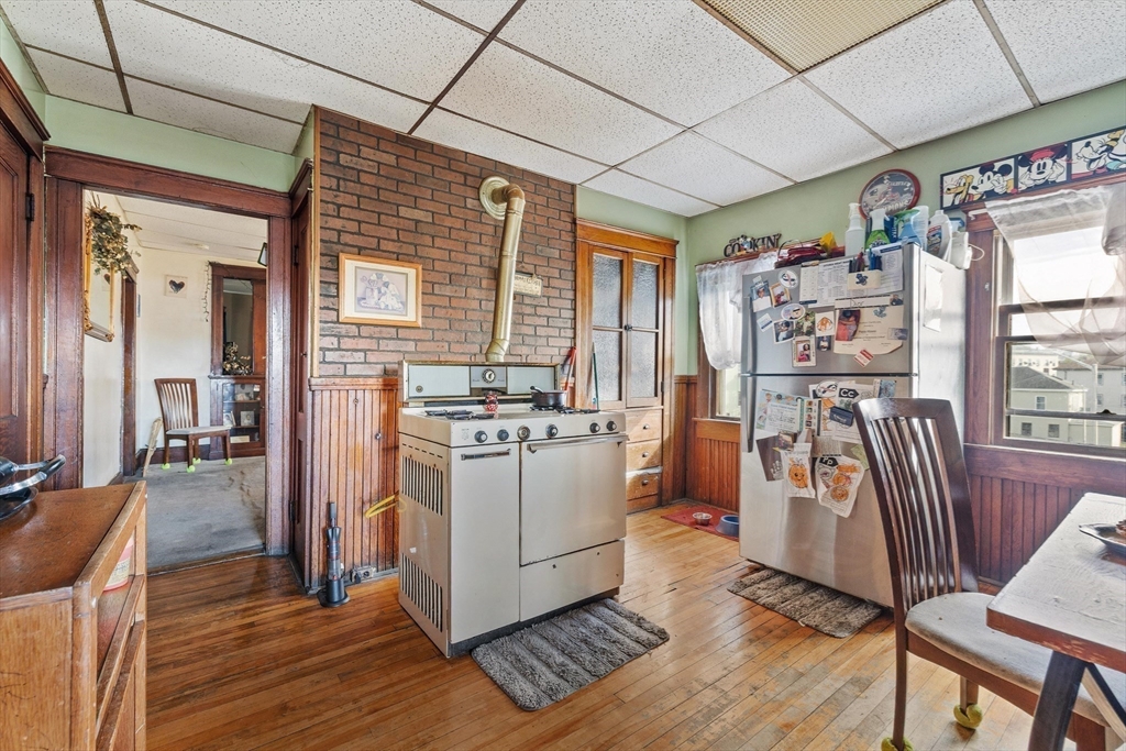 340 Harding Street Worcester, MA 01610 - Photo 26 of 42 a view of a kitchen with furniture and wooden floor