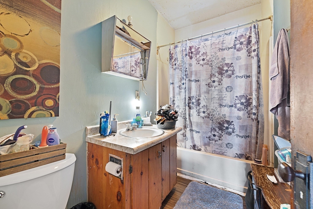 340 Harding Street Worcester, MA 01610 - Photo 29 of 42 a bathroom with a sink and a mirror