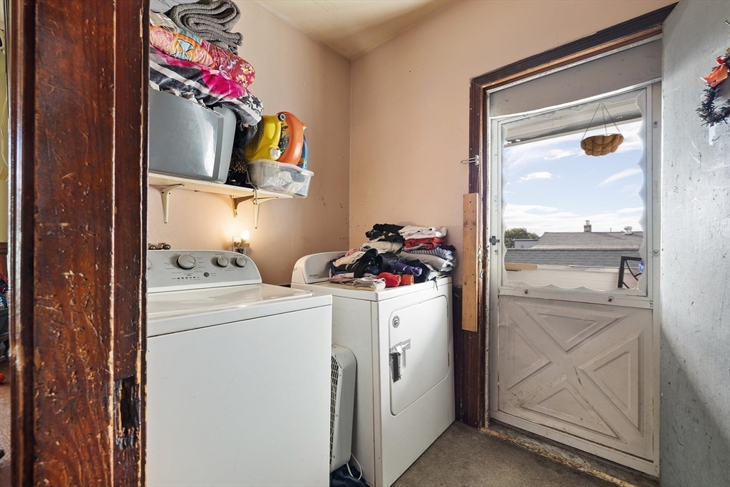 340 Harding Street Worcester, MA 01610 - Photo 30 of 42 a storage room with washer and dryer