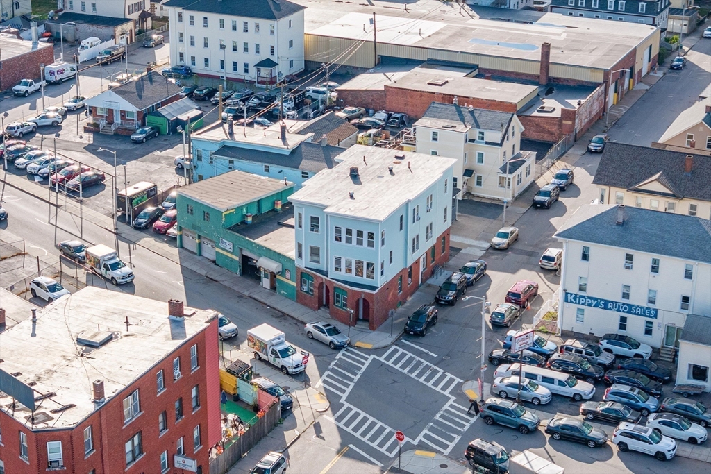 340 Harding Street Worcester, MA 01610 - Photo 3 of 42 a view of a buildings with many windows
