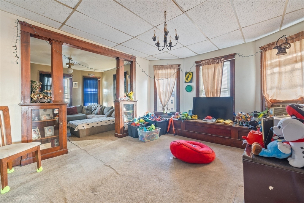 340 Harding Street Worcester, MA 01610 - Photo 31 of 42 a living room with furniture and chandelier