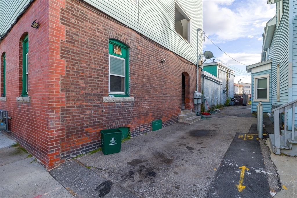 340 Harding Street Worcester, MA 01610 - Photo 38 of 42 a view of a brick house with many windows