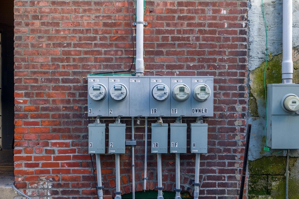 340 Harding Street Worcester, MA 01610 - Photo 41 of 42 a brick wall with a sink and a stove