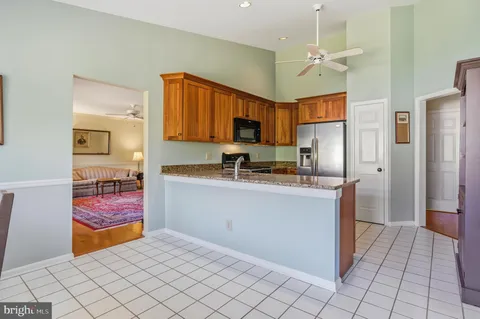 a kitchen with stainless steel appliances granite countertop a sink and a cabinets
