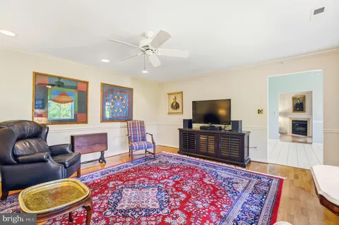 a living room with furniture rug and window