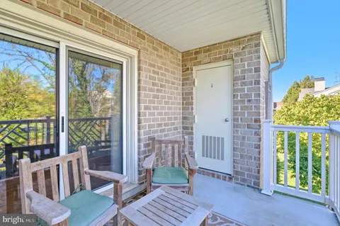 a view of a balcony with wooden floor