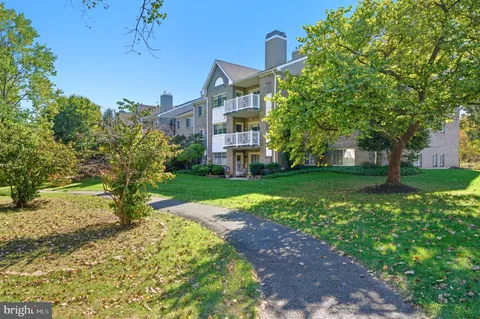 a view of an apartment with a garden