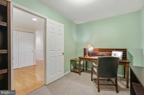 a workspace with furniture and wooden floor