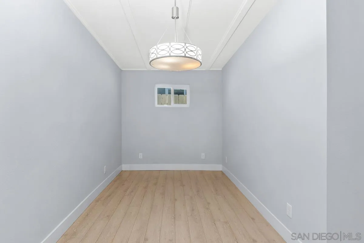 9956 Via Debbie Santee, CA 92071 - Photo 15 of 30 an empty room with wooden floor and windows
