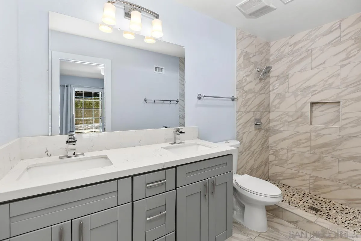 9956 Via Debbie Santee, CA 92071 - Photo 21 of 30 a bathroom with a sink a toilet and shower
